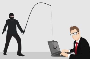 a hacker trying to phish from a personal laptop - Dan Moisand discusses how to avoid financial scams