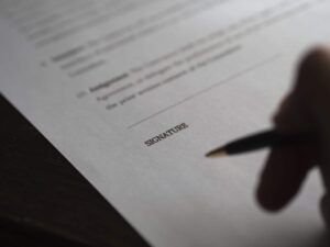 document with signature line - Dan Moisand discusses the estate planning documents most everyone needs