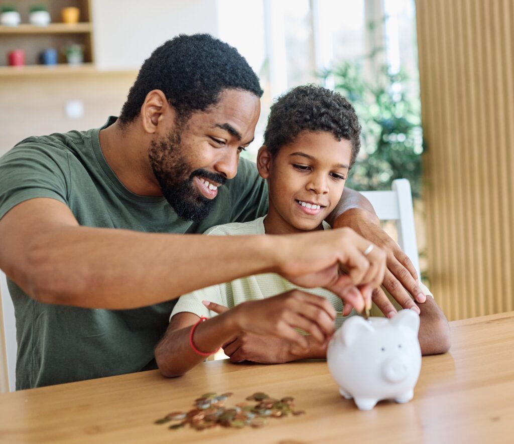 father son and piggy bank